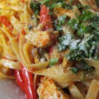 Chicken Fettuccine Picante · Chicken fettuccine grilled strips of chicken breast, mushrooms, red, and green bell peppers,...