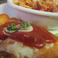 Chicken Parmigiano · A deliciously seasoned breast of chicken, breaded and fried, topped with marinara sauce and ...