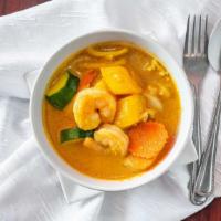 Mango Curry · Gluten-free option available. Yellow curry with mango, chicken, shrimps, onion, carrot, zucc...