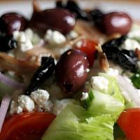Greek Salad (Medium) · Romaine lettuce, tomatoes, cucumbers, red onions, Kalamata olives, Feta cheese and pepperonc...