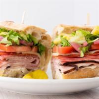 The Italian · Ham, salami, and pepperoni, with green leaf, arugula, pepperoncini, tomatoes, pickled red on...