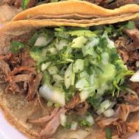 Carnitas Taco · Pulled pork, pico de gallo & guacamole