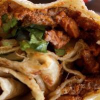 Adobada Burrito · Marinated pork, onion, cilantro & guacamole