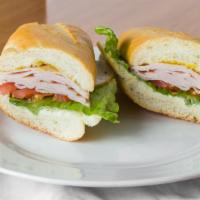 Smoked Turkey · Served with lettuce, tomatoes, mayo, and mustard bread choices.