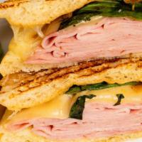 Ham & Swiss Panini · Ham, swiss cheese, basil & honey mustard on ciabatta bread.