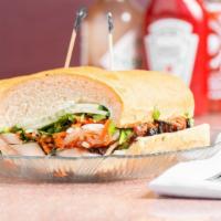 Saigonnaise (Banh Mi Sandwich) · Slow-roasted pork with whole grain mustard and mayo spread, pickled carrot and daikon, cilan...