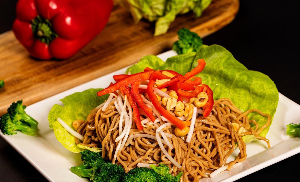 Asian Noodle Salad With Chicken (Large) · Soy-marinated noodles, broccoli, red bell pepper, bean sprouts, grilled chicken and peanuts tossed in a ginger vinaigrette and served on a bed of greens. (dressing mixed in)