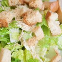 Caesar Salad · Romaine lettuce, asiago cheese and croutons tossed in creamy homemade caesar dressing.