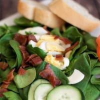 Spinach Salad  · Fresh spinach, crumbled bacon, chopped hard-boiled egg, cucumber and tomato.