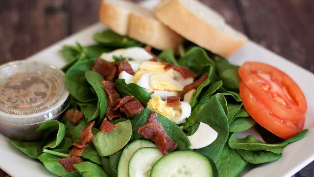Spinach Salad · A fresh spinach, crumbled bacon, chopped eggs, cucumbers, tomato.