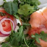 Lox Bagel · Bagel topped with cream cheese, wild lox, onions, tomatoes, and capers.