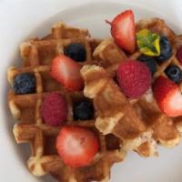 Liege Waffles · Decadent waffles made with Belgium pearl sugar. Topped with fresh berries.