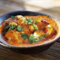Paneer Butter Masala · Gluten Free. Spicy. Cubed Paneer, Tomato, Butter, Cream, Indian Spices.