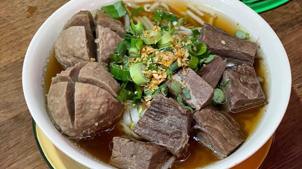 Thai Stew Beef Noodle Soup · A cozy, street style stew beef noodle soup, hours of simmering beef broth and tendered beef, with rice noodle and beef balls