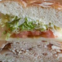 Turkey Supreme · Turkey Breast, Jack Cheese, Lettuce, Tomato and Mayonnaise on a Kaiser Roll.