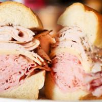 New Yorker · Smoked Ham, Turkey Breast, Swiss Cheese, Lettuce, Tomato and Russian Dressing on a French Ro...