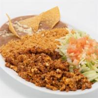 Huevos Con Chorizo · Three scrambled eggs mixed in with pork sausage.  Served with rice, beans and salad. Option ...
