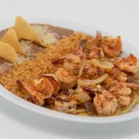Camarones Al Mojo De Ajo · Shrimp butterflied, either grilled or in a garlic butter sauce. Served  with rice, beans, sa...