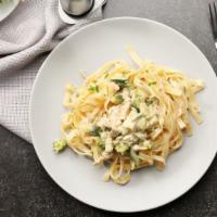 Fettuccine Alfredo · An aromatic pasta dish consisting of fettuccine with butter, Parmesan cheese, cream, and sea...