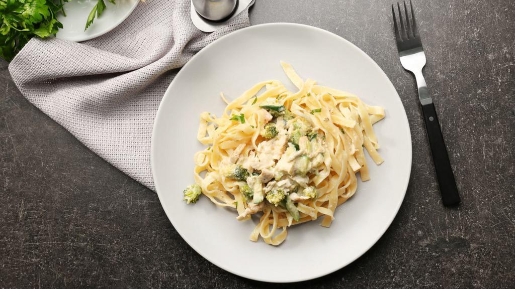 Fettuccine Alfredo · An aromatic pasta dish consisting of fettuccine with butter, Parmesan cheese, cream, and seasonings.