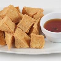 Fried Tofu · Bitesized pieces of deep fried tofu served with sweet sauce topped with crushed peanuts.