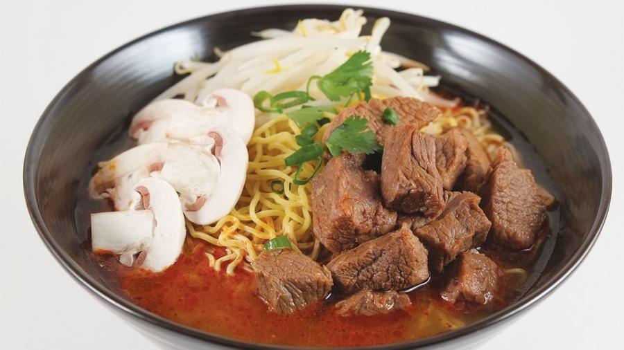 Beef Tom Yum Ramen · Beef stew, cilantro, green onions, bean sprouts, mushrooms, spicy tom yum broth, and ramen noodles.