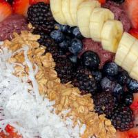 Acai Bowl · Acai sorbet, fresh strawberries, banana, blueberries, coconut shavings, granola and honey