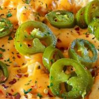 Jalapeño Loaded Fries W/Cheese · Melted Cheddar Cheese on side + jalapenos