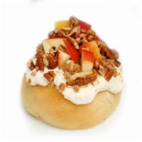 Apple Pecan Pie Roll · Caramel frosting topped with fresh apples, pecans, and our homemade pie crumble