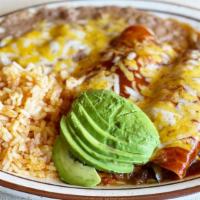 Enchiladas Rancheras (Dsu04) · Two enchiladas (beef or chicken) served with beans and rice.