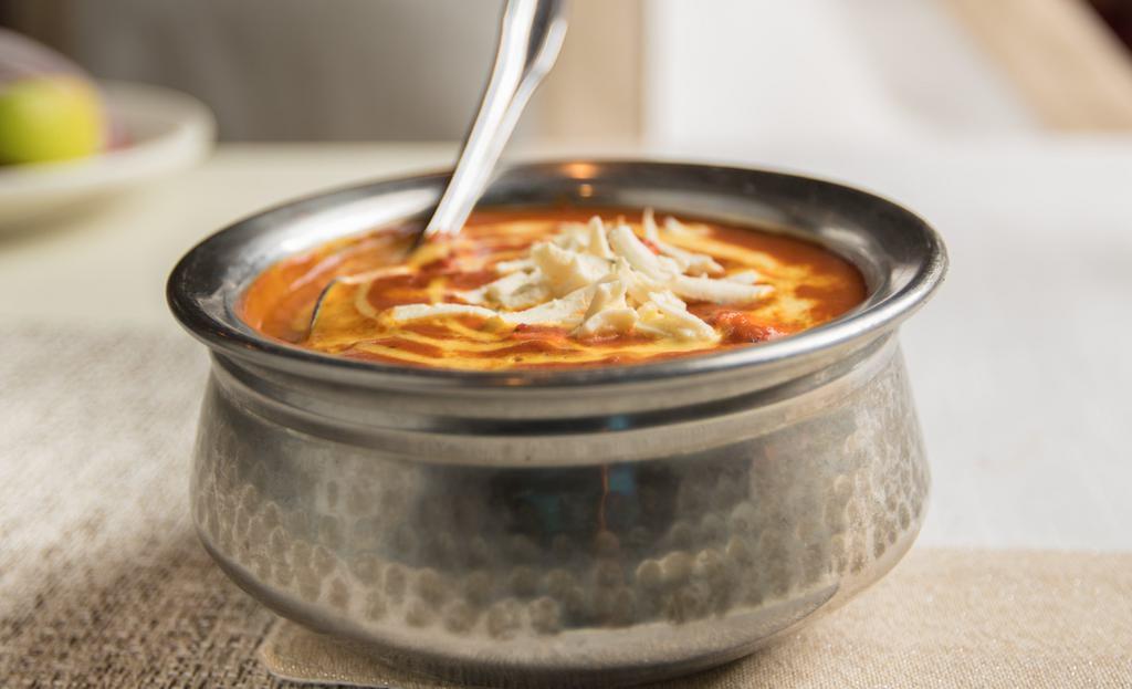 Chicken Tikka Masala · Cubes of tender chicken marinated in thick yogurt sauce and then grilled in a clay oven before the chicken is dipped in a rich gravy and simmered for consistency.