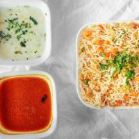 Vegetable Biryani · Basmati rice cooked with a variety of fresh seasonal vegetables, blended with herbs and spic...