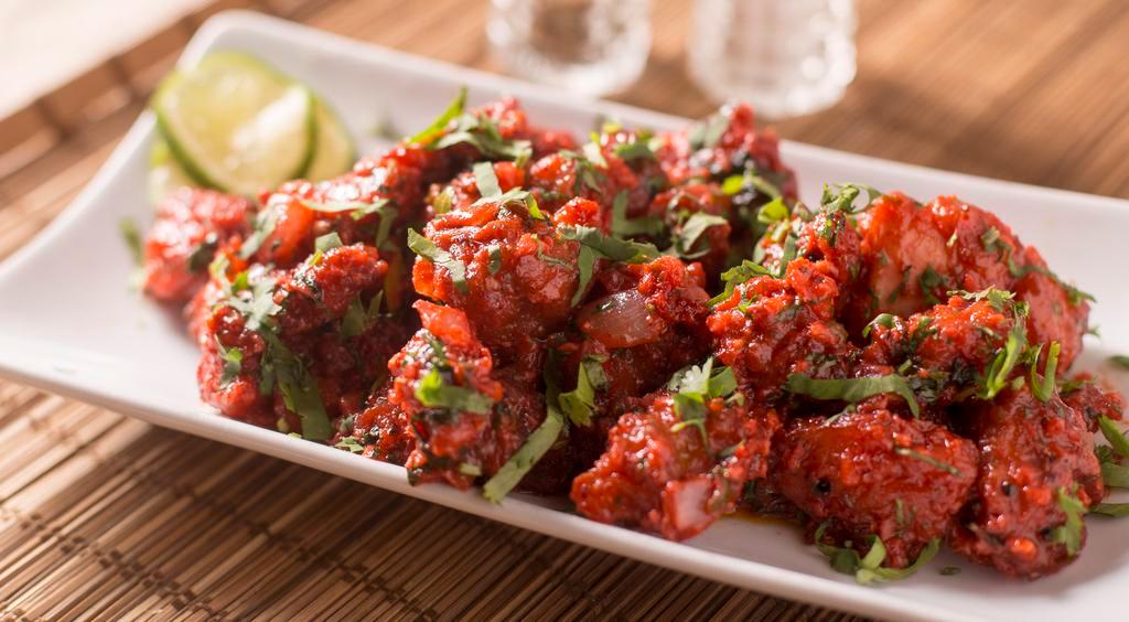 Chicken 65 · Boneless chicken cubes marinated in hand made indian masala's and deep fried.