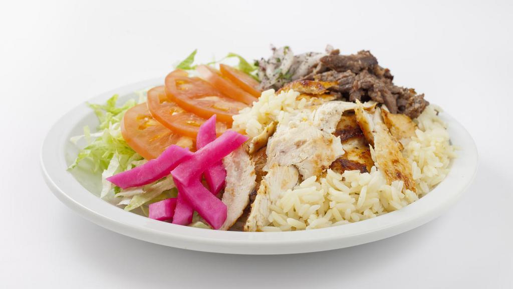 Combo Platter · Delicious juicy chicken and gyro meat with salad, rice, salata, tzatziki sauce, hummus and pita bread.