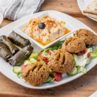 Falafel And Gyro Platter · Delicious crispy fritters and yummy gyro meat with salad, rice, salata, tzatziki sauce, humm...