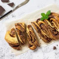 Mediterranean Nut Roll · Delicious filo pastry with honey, chocolate, and nuts.