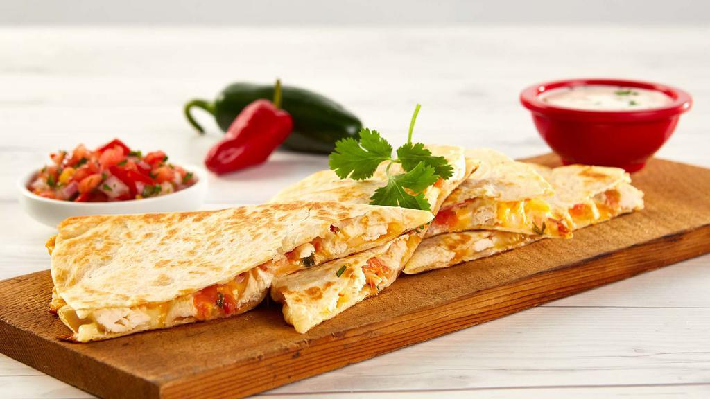 Grilled Chicken Quesadilla · Served with rice and beans garnished with pico de gallo, crema and queso fresco.
