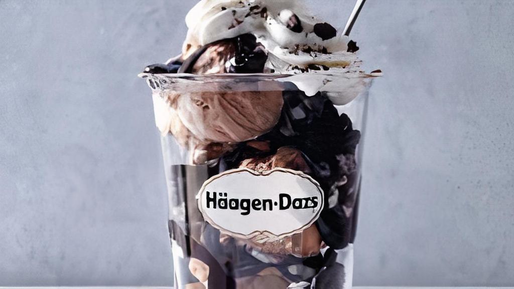Rocky Road Dazzler Sundae · Rocky road ice cream layered with hot fudge and chocolate cookie pieces topped with whipped cream and chocolate cookie crunch. Served with toppings.