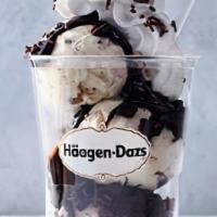 Mint Chip Dazzler Sundae · Mint chip ice cream layered with hot fudge and chocolate cookie pieces topped with whipped c...