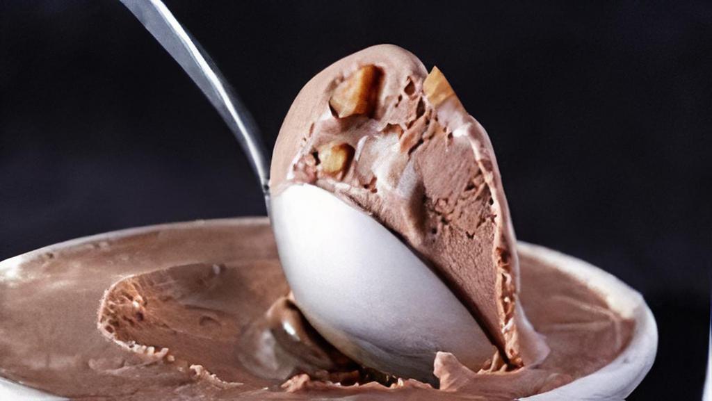 Rocky Road · Velvety swirls of marshmallow, roasted almonds, and our legendary chocolate ice cream come together in this playful ice cream delight.