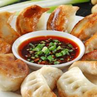 Pork Potstickers (6)猪肉锅贴 · 6 Piece pan-fried pork dumplings