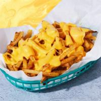 Cheese Fries · Crispy fries smothered in melted cheese.