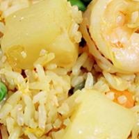 Pineapple Fried Rice · With shrimp, chicken, pineapple, peas and carrots.