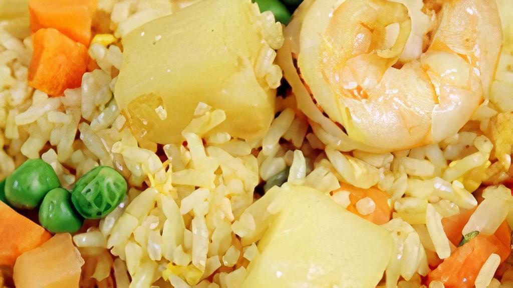 Pineapple Fried Rice · With shrimp, chicken, pineapple, peas and carrots.