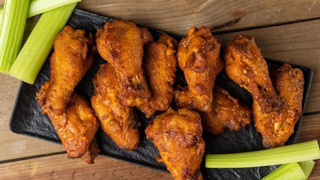 Just Wing It · crispy buttermilk marinated boneless chicken wings, served with carrots, celery & ranch or bleu cheese