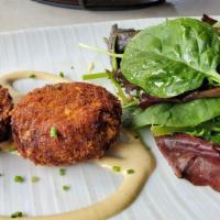 Crab Cakes · Two crab cakes served with sms spicy mustard sauce and organic greens.