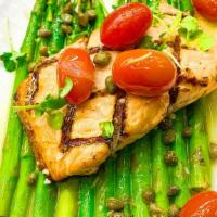 Grilled Salmon · Served with grilled asparagus, blistered cherry tomatoes and finished with lemon-caper butter.