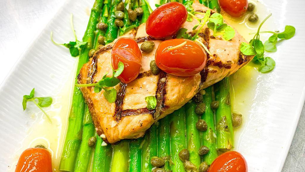 Grilled Salmon · Served with grilled asparagus, blistered cherry tomatoes and finished with lemon-caper butter.