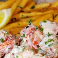 Lobster Roll · Maine lobster meat with lemon aioli and chopped chives in a butter toasted rockenwagner brio...