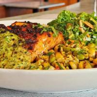 Grilled Cajun Salmon Bowl · Cajun seasoned salmon served over rice with mixed kale and a traditional corn salad. Served ...